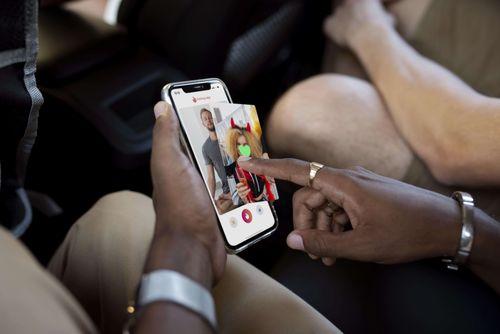 person-holding-smartphone-with-dating-app (1).jpg